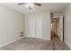 Bedroom showcasing a ceiling fan, carpet, and closet for ample storage space at 1074 Cherokee Hts, Stone Mountain, GA 30083