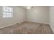 Bedroom featuring neutral walls, carpet, and a window for natural light at 1074 Cherokee Hts, Stone Mountain, GA 30083