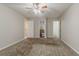 Bedroom with ceiling fan, carpet, and access to a bathroom at 1074 Cherokee Hts, Stone Mountain, GA 30083