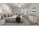 Tastefully decorated bedroom featuring a cozy bed, natural light, and modern furniture, designed for comfort at 1074 Cherokee Hts, Stone Mountain, GA 30083