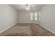 A spacious bedroom with plush carpet and large windows offers a relaxing retreat at 1074 Cherokee Hts, Stone Mountain, GA 30083