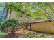 Charming home exterior with stone accents and lush greenery, providing ample shade at 1074 Cherokee Hts, Stone Mountain, GA 30083