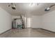 An unfinished two car garage with a water heater and furnace at 1074 Cherokee Hts, Stone Mountain, GA 30083