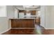 A clean kitchen is equipped with white appliances and wood cabinets at 1074 Cherokee Hts, Stone Mountain, GA 30083