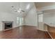 A cozy living room featuring a fireplace, vaulted ceiling, and natural light, perfect for relaxation at 1074 Cherokee Hts, Stone Mountain, GA 30083