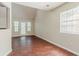 A living room is brightened by natural light, enhanced by laminate flooring, and featuring a vaulted ceiling at 1074 Cherokee Hts, Stone Mountain, GA 30083