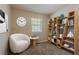 Office space with bookshelves, decor, a window for natural light, chair, and small table at 1074 Cherokee Hts, Stone Mountain, GA 30083