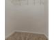 An empty walk-in closet with carpeted floor and hanging rod for clothes and accessories storage at 1074 Cherokee Hts, Stone Mountain, GA 30083