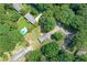 Aerial view showcases a large lot with lush landscaping and mature trees surrounding this home at 232 Hembredge Dr, Canton, GA 30115