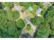 Aerial image of the property showing the house nestled among mature trees on a generous lot at 232 Hembredge Dr, Canton, GA 30115