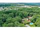 Beautiful aerial view showcases the home, pool, and expansive, tree-lined lot at 232 Hembredge Dr, Canton, GA 30115