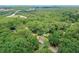 Stunning aerial view of a secluded property surrounded by lush greenery and mature trees at 232 Hembredge Dr, Canton, GA 30115