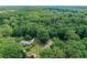 Wide aerial of the neighborhood with mature trees, highlighting the home's location and surrounding environment at 232 Hembredge Dr, Canton, GA 30115