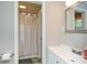 Updated bathroom features a shower with curtain, vanity and sleek sink and fixtures at 232 Hembredge Dr, Canton, GA 30115