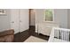 Bright Bedroom includes hardwood floors, a dresser, closet, and access to the hallway at 232 Hembredge Dr, Canton, GA 30115