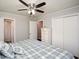This bedroom includes hardwood floors, ceiling fan, and access to a bathroom with a shower at 232 Hembredge Dr, Canton, GA 30115