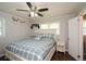 Comfortable bedroom features ceiling fan, hardwood floors and a window to let natural light in at 232 Hembredge Dr, Canton, GA 30115