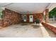 Spacious brick carport area with room for parking and outdoor activities, plus convenient access to the house at 232 Hembredge Dr, Canton, GA 30115
