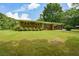 A classic brick home with a sprawling front yard and covered parking at 232 Hembredge Dr, Canton, GA 30115