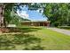 Brick house, large yard, storage building, and driveway at 232 Hembredge Dr, Canton, GA 30115