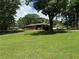 Ranch style home with level yard, carport, and close to mature trees at 232 Hembredge Dr, Canton, GA 30115