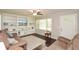 Cozy living room features hardwood floors, custom bookshelves, and large windows at 232 Hembredge Dr, Canton, GA 30115