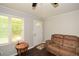 Cozy living room features hardwood floors, large window, and neutral paint at 232 Hembredge Dr, Canton, GA 30115
