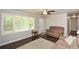 Inviting living room featuring hardwood floors, large windows, and neutral paint at 232 Hembredge Dr, Canton, GA 30115