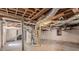Unfinished basement with exposed ductwork, concrete floors and walls, and supporting beams at 2755 Rockcliff Se Rd, Atlanta, GA 30316