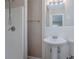 Bright bathroom featuring a toilet, sink, shower with glass door and towel rack at 2755 Rockcliff Se Rd, Atlanta, GA 30316