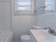 Bright bathroom featuring a toilet, sink, and window that provides natural light at 2755 Rockcliff Se Rd, Atlanta, GA 30316