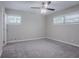 Bedroom with neutral walls, carpet, a ceiling fan, and natural light from the windows at 2755 Rockcliff Se Rd, Atlanta, GA 30316