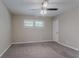 Bedroom with neutral walls, carpet, a ceiling fan, a window, and a closet door at 2755 Rockcliff Se Rd, Atlanta, GA 30316