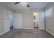 Bedroom features neutral walls, carpet, closet, an open bathroom, and natural light at 2755 Rockcliff Se Rd, Atlanta, GA 30316