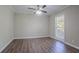 Bedroom featuring laminate floors, neutral paint, white trim and a large window at 2755 Rockcliff Se Rd, Atlanta, GA 30316