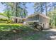 Two-story gray brick home featuring a well-maintained lawn and established shrubbery at 2755 Rockcliff Se Rd, Atlanta, GA 30316