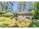 Charming single-Gathering home with a well-manicured lawn and lush greenery in a neighborhood setting at 2755 Rockcliff Se Rd, Atlanta, GA 30316