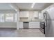 Modern kitchen features white cabinets, stainless steel appliances and beautiful granite countertops at 2755 Rockcliff Se Rd, Atlanta, GA 30316