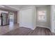 Open kitchen area features white cabinets, stainless appliances and gray laminate floors at 2755 Rockcliff Se Rd, Atlanta, GA 30316