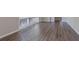 Spacious living room featuring laminate floors, neutral paint and multiple windows at 2755 Rockcliff Se Rd, Atlanta, GA 30316
