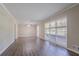 Spacious living room filled with light features laminate floors and neutral paint at 2755 Rockcliff Se Rd, Atlanta, GA 30316