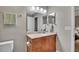 Bathroom with tile floors, granite vanity, and a large mirror at 301 Mill Pond Se Ct, Smyrna, GA 30082