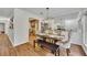 Modern dining room featuring a beautiful table setting with access to a well-equipped kitchen for easy meal preparation at 301 Mill Pond Se Ct, Smyrna, GA 30082