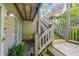 This home features beautiful wooden stairs leading to the second floor, complemented by lush greenery and a cozy outdoor space at 301 Mill Pond Se Ct, Smyrna, GA 30082