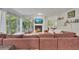 Spacious living room with comfortable seating, a cozy fireplace, and abundant natural light from large windows at 301 Mill Pond Se Ct, Smyrna, GA 30082