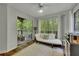 Bright sun room with lots of windows and access to the deck at 301 Mill Pond Se Ct, Smyrna, GA 30082