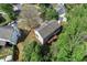 Home aerial view showing back of home, mature trees, and surrounding neighborhood at 531 Chadborn Ct, Lawrenceville, GA 30045