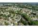 Neighborhood aerial view showing homes surrounded by mature trees and lush green landscaping at 531 Chadborn Ct, Lawrenceville, GA 30045