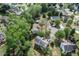 Home aerial view showing backyard, mature trees, lush green landscaping and neighborhood at 531 Chadborn Ct, Lawrenceville, GA 30045