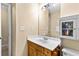 Bathroom featuring a vanity with wood cabinets, a framed mirror, and a toilet at 531 Chadborn Ct, Lawrenceville, GA 30045